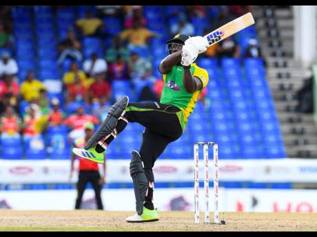 Rovman Powell of Jamaica Tallawahs hits a six during the Men’s 2022 Hero Caribbean Premier League cricket match 4 between Jamaica Tallawahs and Guyana Amazon Warriors at Warner Park Sporting Complex on Saturday in Basseterre, St Kitts and Nevis. 