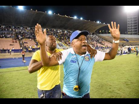 Lenworth Hyde (right), head coach, Clarendon College, celebrates their Olivier Shield victory over Kingston College at the National Stadium in 2019.