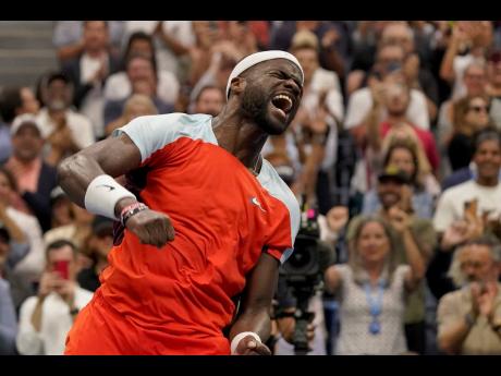 Frances Tiafoe of the United States reacts after defeating Andrey Rublev of Russia during the quarter-finals of the US Open tennis championships yesterday in New York.
