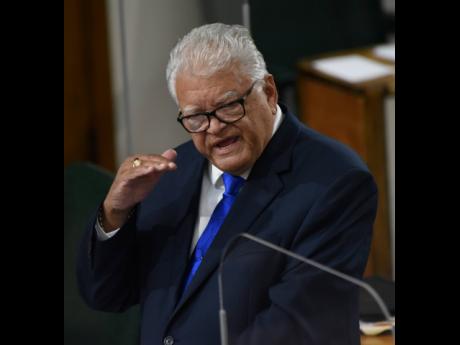 Karl Samuda, the minister of labour and social security.