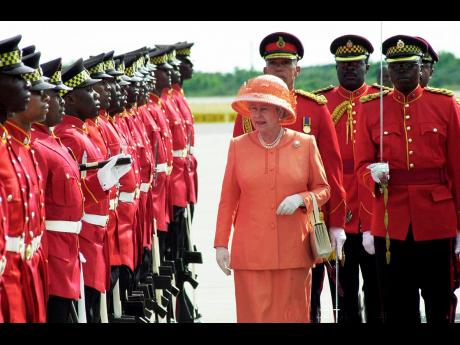 Queen Elizabeth II inspecting the guard of honour during her 2002 visit to Jamaica.