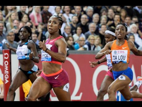 Shelly-Ann Fraser-Pryce (centre) of Jamaica crosses the finish line to win the women’s 100 metres at the Diamond League  finals in Zürich, Switzerland, on Thursday, September 8. Fraser-Pryce won in 10.65 seconds.