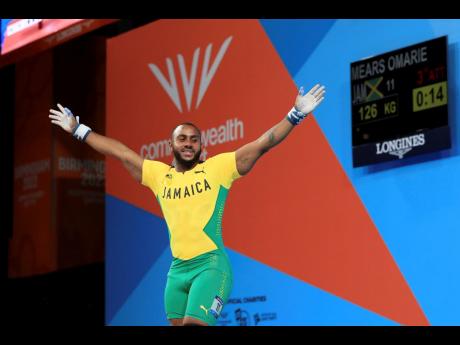 Jamaica’s Omarie Mears celebrates making a lift during the men’s 81kg weightlifting competition at the 2022 Commonwealth Games in Birmingham, England.