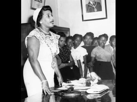 
In this April 1958 photo, the first woman mayor of the Corporate Area and the West Indies, Councillor Iris King, makes her maiden speech after she was invested with the chain of office. 