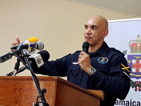 Police Commissioner Major General Antony Anderson addressing a stakeholders meeting with members of religious communities, justices of the peace and business leaders in Westmoreland at the  Savanna-la-Mar United Church Hall.