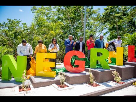 Negril’s Jam-Iconic $12-million welcome sign, sponsored by the Tourism Product Development Company Ltd (TPDCo), with construction by C. J’s Construction, now greets travellers to the resort town following its official unveiling last Friday. Minister of