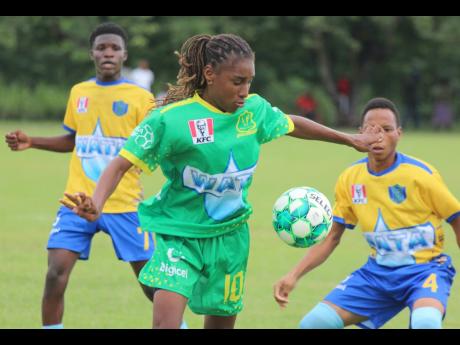 Old Harbour High School’s dreadlocked play-maker Shyjah Orridge watches the ball intently during the ISSA/Digicel daCosta Cup group M  football match against Tacius Golding High School at Port Esquivel in St Catherine yesterday. Old Harbour High won 3-1.