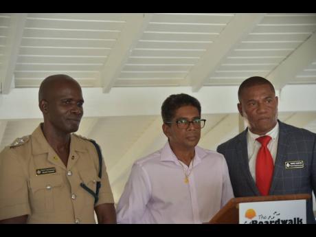 From left: Commanding Officer of the Westmoreland police, Senior Superintendent Wayne Josephs; President of the Negril Chamber of Commerce Richard Wallace; and Deputy Superintendent Delroy Stewart address stakeholders at a recent meeting in the resort town