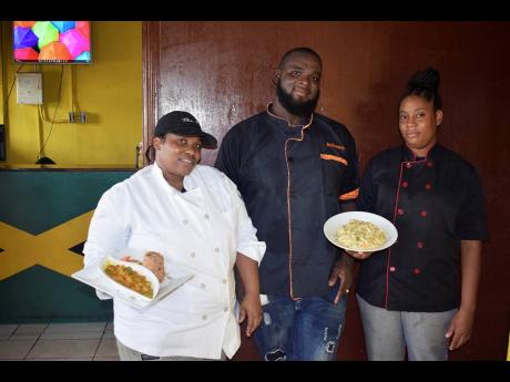 Restaurant owner and head chef, Dale Ferguson, is sandwiched by his dedicated team, chefs Shannette Hunter (left) and Gizzelle Levy.
