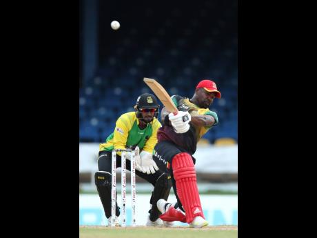 Darren Bravo of St Kitts & Nevis Patriots hits a six run over midwicket during the Men’s 2022 Hero Caribbean Premier League T20 cricket match against Jamaica Tallawahs at Queen’s Park Oval in Port of Spain, Trinidad & Tobago, yesterday.