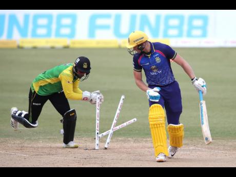 Corbin Bosch (right) of Barbados Royals is stumped by Amir Jangoo off the bowling of Imad Wasim of Jamaica Tallawahs during the  2022 Hero Caribbean Premier League match between Barbados Royals and Jamaica Tallawahs at the Queen’s Park Oval in Port of Sp