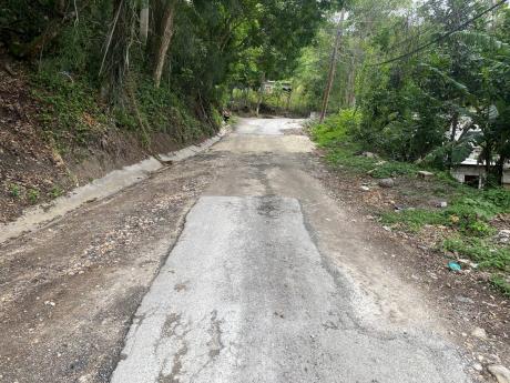 A road in need of repair in St Andrew East Rural.