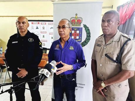 National Security Minister Dr Horace Chang (centre); Police Commissioner Major General Antony Anderson (left) and Senior Superintendent of Police Wayne Joseph, head of the Westmoreland police division speaking with journalists at a media briefing on securi