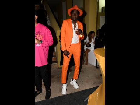 It didn’t take more than one shade of orange for partygoer Kevin Howell to stand out in the crowd.