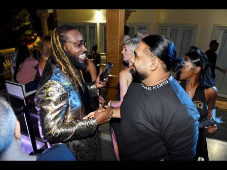 We spotted Chris Gayle greeting popular entertainment manager and business man Romeich.