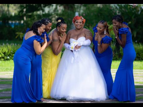 The bridesmaids, elegantly dressed in royal blue and yellow, and maid of honour remain in awe of the bride’s beautiful wedding.