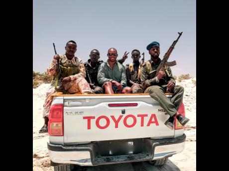 Romaine Welds heading to the beach with soldiers in Mogadishu, Somalia.