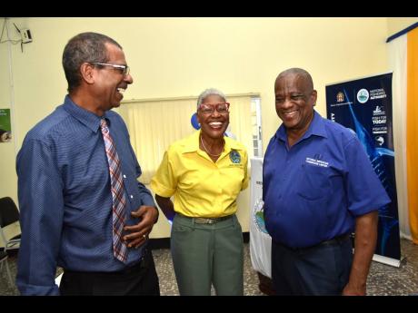 Dr Gavin Bellamy (left), chief executive officer of the National Fisheries Authority (NFA); Angela Patterson, director of corporate services at the NFA; and State Minister Franklin Witter share a light moment during the launch of the ‘Many Moods of Tilap