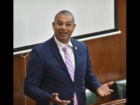 Mikael Phillips, Manchester North Western member of parliament, addresses lawmakers in his State of the Constituency Debate presentation on Tuesday. 
