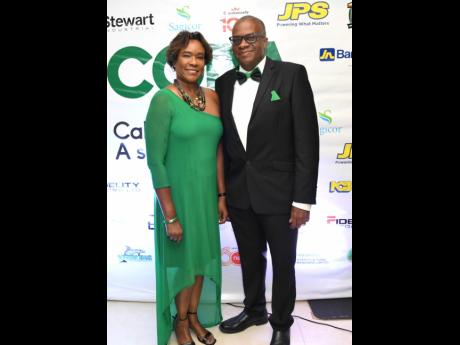 Allison Roofe was appropriately attired in green while out to celebrate Calabar with husband, Michael, whose bow tie and pocket square complemented her look.