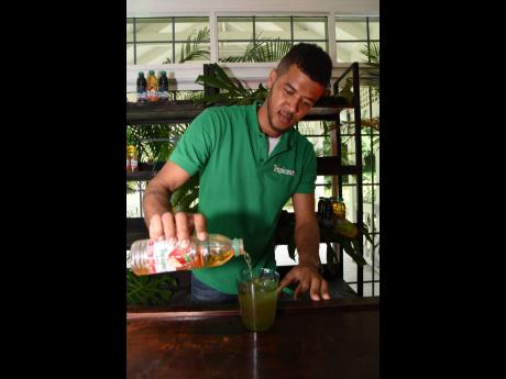 We snapped Mixologist Sheldon Spencer topping up a spirited cocktail with a refreshing splash of Tropicana Apple.