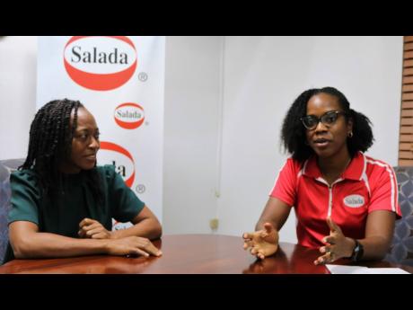 General Manager at Salada Foods Jamaica Limited, Tamii Brown and Quality Assurance Manager Nadine Francis (left), speak about the company’s recent efforts to get staff to contribute to its plastic bottle recycling drive, in a first step to reducing its c