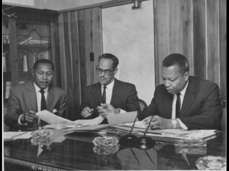 Prime Minister Hugh Shearer (right) with (from left) James M. Lloyd, permanent secretary in the Ministry of Defence, and J.B. McFarlane, permanent secretary in the Prime Minister’s Office. 
