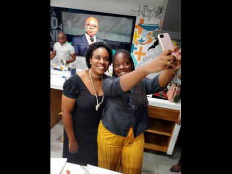 The Gleaner’s Assistant Online and Lifestyle Editor, Debra Edwards takes a picture with intern Kerese Oakley-Williams at a Jamaica Food and Drink Kitchen event.