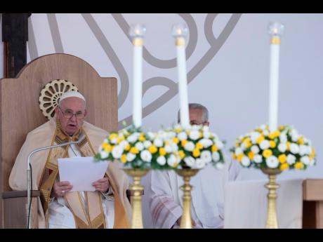 Pope Francis delivers his speech as he celebrates mass on the occasion of the 27th national Eucharistic congress, in Matera, southern Italy.