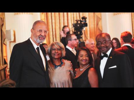 US Ambassador to Jamaica Nick Perry (right), and his wife, Joyce (second right), share lens time with Ambassador Pamela Bridgewater, former United States ambassador to Jamaica, and her husband Reverend A. Russell Awkard.