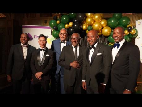Executive (from left): Derrick Cotterell, chairman and chief executive officer, Derrimon Trading Company; Chris Yeung, managing director, FirstRock Private Equity; Michael Banbury, director, FirstRock Real Estate Investments Limited; Norman Reid, chairman,