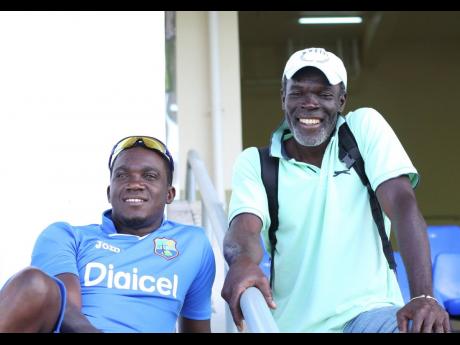 Winston Benjamin (right) and Jamaica’s Jerome Taylor at the Sir Vivian Richards Cricket Ground in Antigua and Barbuda on Thursday, April 9, 2015,