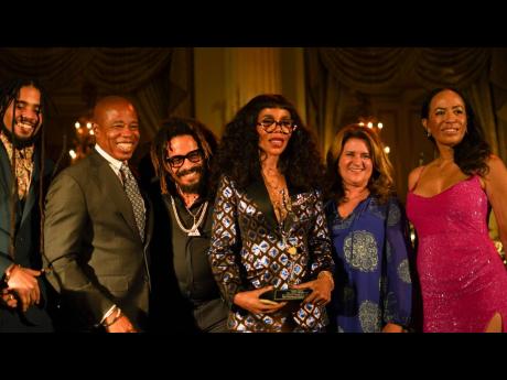 Cedella Marley is joined by, from left: son Skip Marley; Mayor of New York, Eric Adams; brother Rohan Marley; AFJ’s President, Wendy Hart; and Executive Director, Caron Chung.