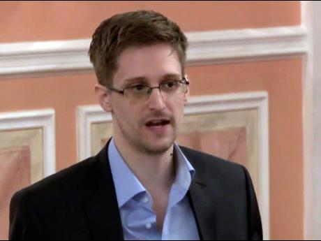 In this image made from video and released by WikiLeaks, former National Security Agency systems analyst Edward Snowden speaks in Moscow on October 11, 2013. 