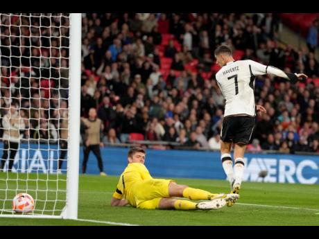 Germany’s Kai Havertz  (right) scores his side’s third goal during the UEFA Nations League match between England and Germany at Wembley stadium in London yesterday.