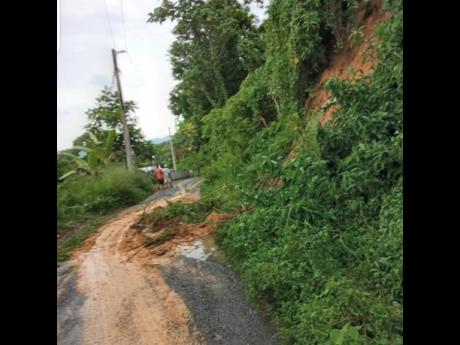 The Torrington to Pennycooke main road in Westmoreland, affected by land slippage as a result of ongoing rains yesterday.