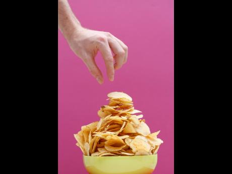 Eating snacks like potato chips that are packed with fats and empty carbs can contribute to obesity and heart disease.