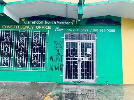 The defaced wall of the constituency office of Clarendon North Western Member of Parliament Phillip Henriques on Monday.