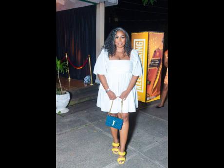 Influencer and Executive Financial Advisor Tiffany Lawson was dressed to impress with pops of colour in her yellow sandals and Yves Saint Laurent purse.