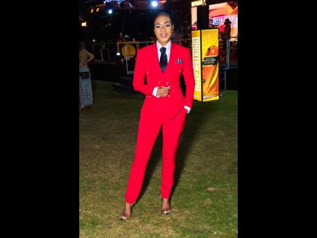 Right: Author and host Dr Terri-Karelle Reid upped the style quotient in this red tailored men’s suit. 