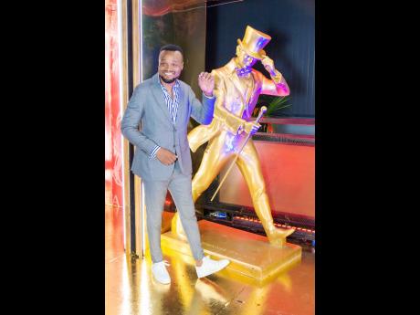 Red Stripe’s Brand Manager Nathan Nelms shows off his best Johnnie Walker striding man pose.