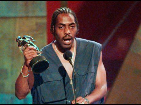Coolio, whose legal name was Artis Leon Ivey Jr., accepts the award for the Best Rap Video at the MTV Video Music Awards in New York on September 4, 1996. 