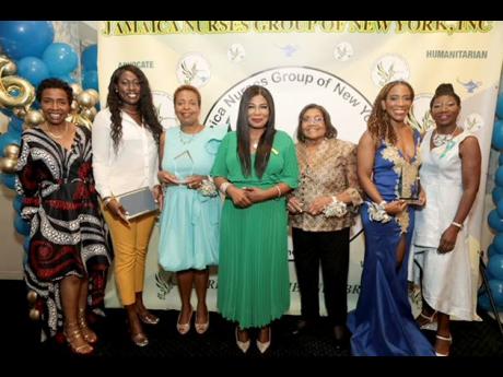 From left are: Congresswoman Yvette Clarke; scholarship awardee Zonika Tracey; honoree and former president Claudette Powell; Jamaica’s consul general in New York, Alsion Wilson; honoree Pamella Hosang; honoree, Global North East diaspora representative,