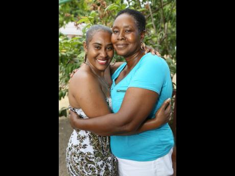 Nathalee Frank shares a warm embrace with her mother, Sheron Howell, whose love of children has influenced her decision to become an early childhood educator.