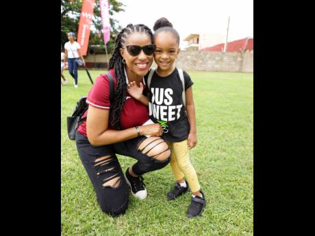 Kayon Mitchell (left), Flow’s Director of Communications, and niece Kahli Wallace who is just too sweet were out to support  Wolmer’s.