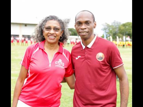 Grace Baston (left), principal of Campion College and Dwight Pennycooke, principal of Wolmer’s Boys School were out to show their full support for the annual reunion football match which was being hosted in Jamaica for the first time last Saturday at Wol
