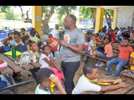 RISE Life Management Facilitator Jason Dawson gives a self-empowering speech to the campers of the Junior Creator Robotic Camp at Ardenne High School.