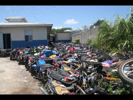 In this file photo, impounded motorcycles are strewn along the ground at the Hanover Police Headquarters in Lucea.
