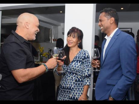 Deja Vu Resorts’ Robin Russell (left), engages in cheerful conversation with Vivene Livas, general manager, Great Huts Resort, and Dr Carey Wallace (right), executive director, Tourism Enhancement Fund. 