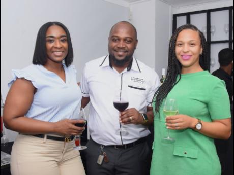 From left: Aldria Grant, administrative consultant, DownSound Entertainment; Nevin Nish, real estate broker, Keller Williams Jamaica; and IS Home Design Build Ltd’s Iman Stewart enjoy wine and conversation at Wednesday’s cocktail reception. 